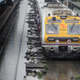 A Mumbai local train moves through a water-logged track on July 1, 2019.